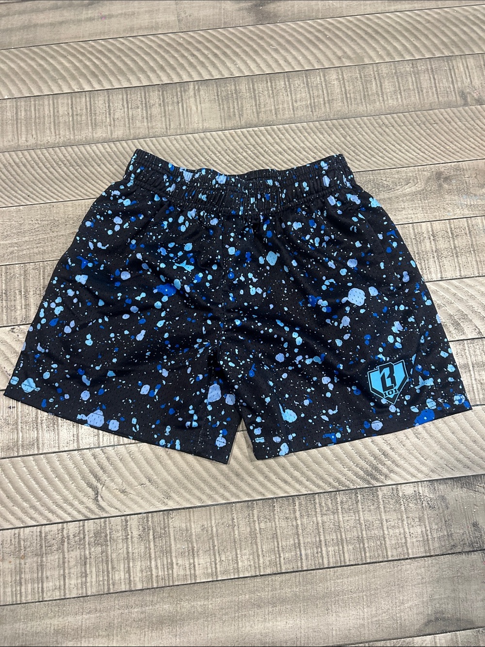 Kids Black Splatter Athletic Shorts with Blue Accents